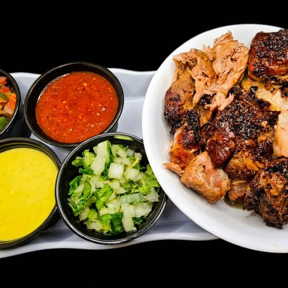 Grilled chicken pieces with four side dishes of salsa, yellow sauce, and chopped vegetables.
